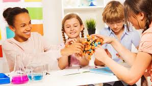 Elementary students working on a hands-on science experiment